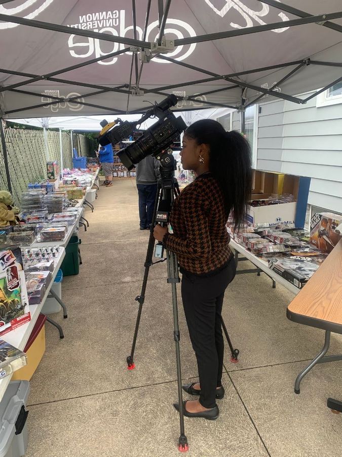 A television news crew filming the sale
