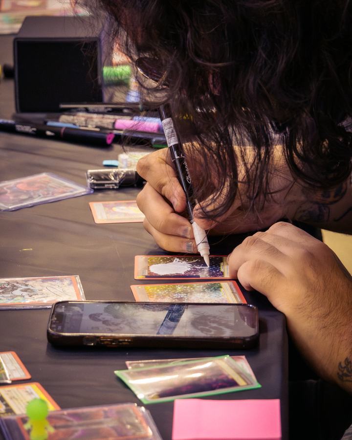 Signing cards at the table