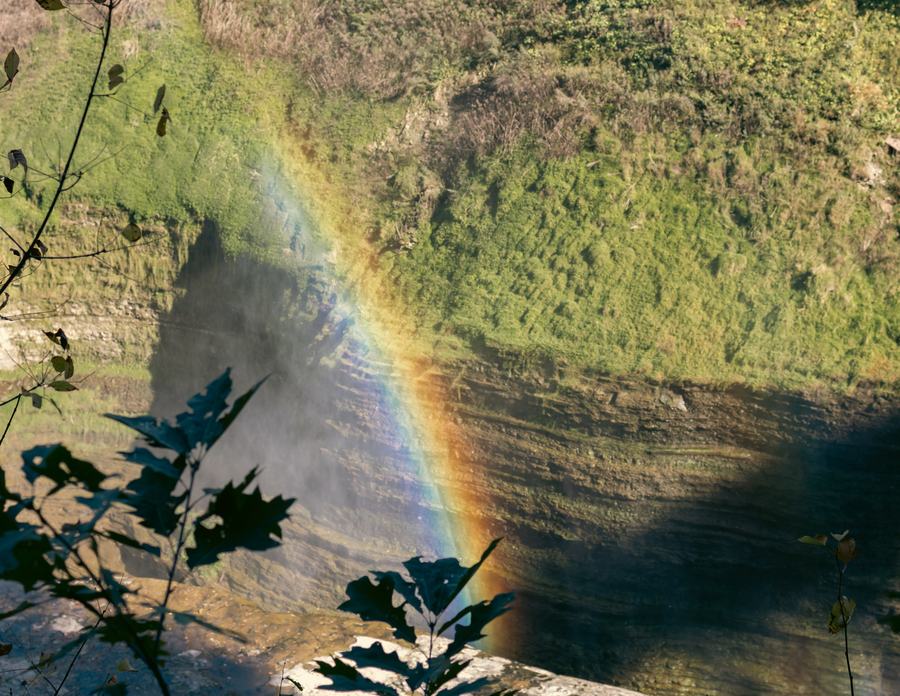 A rainbow across the gorge wall