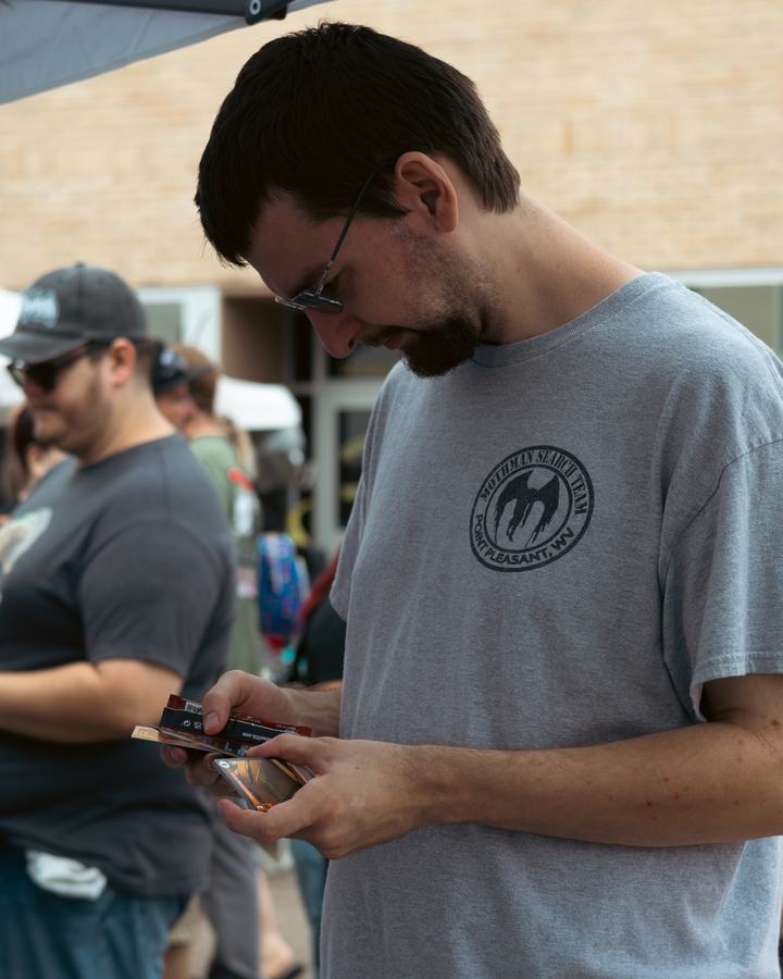A player checking his cards