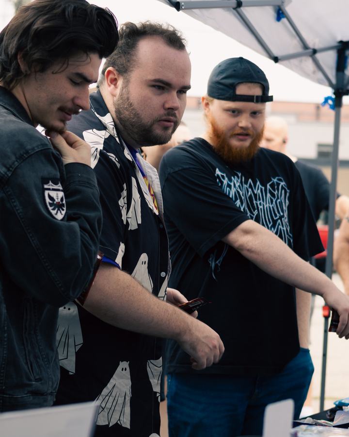 Players gathered at the booth table