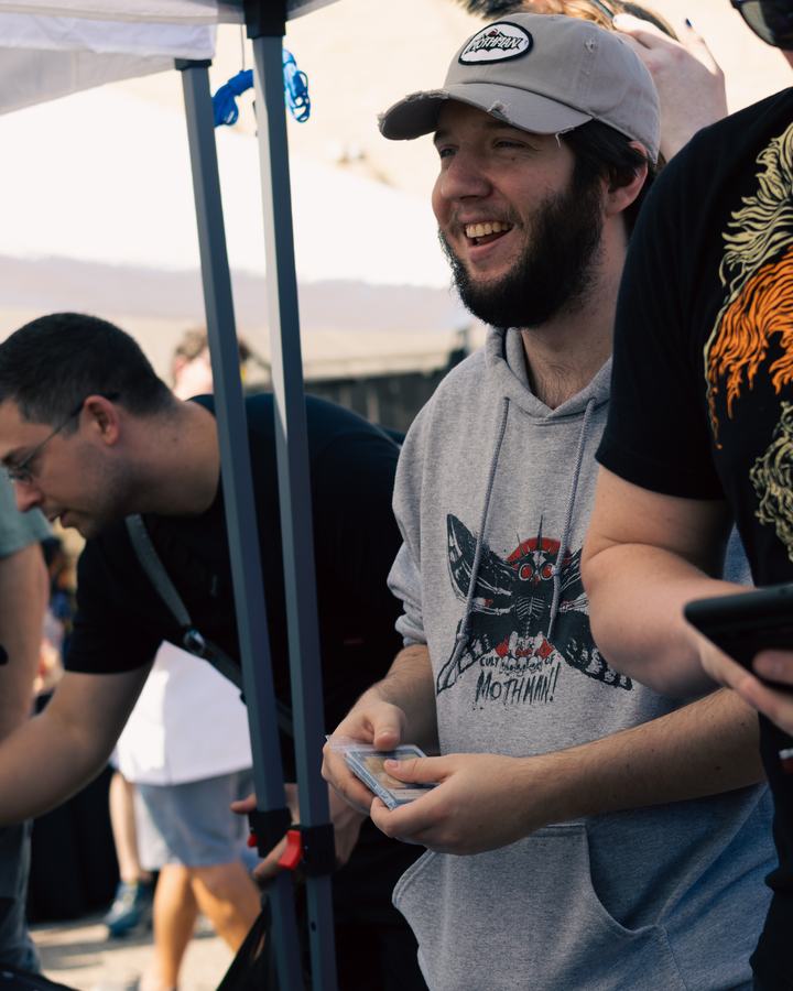 A laughing player under the tent